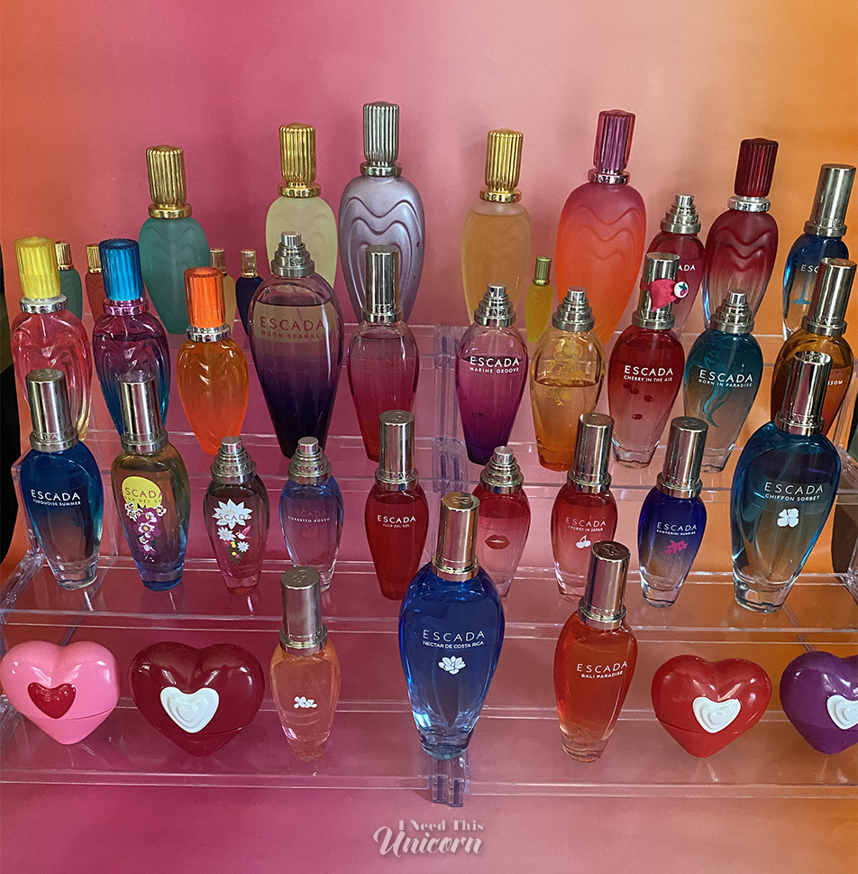 Escada Bottles all lined up on an acrylic stand