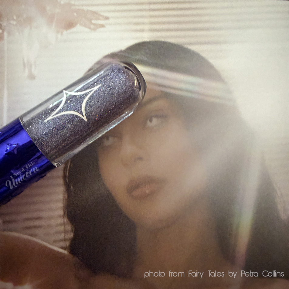 Half Magic Euphoria Glitter Pill in "Glitter Tears" pictured with a photo of Alexa Demie from the book "Fairy Tales" Photographed and co-authored by Petra Collins