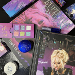Euphoria-inspired beauty flatlay with Half Magic makeup, Petra Collins books, Fairy Tales magazine, glitter cosmetics, and HBO Euphoria collector items.
