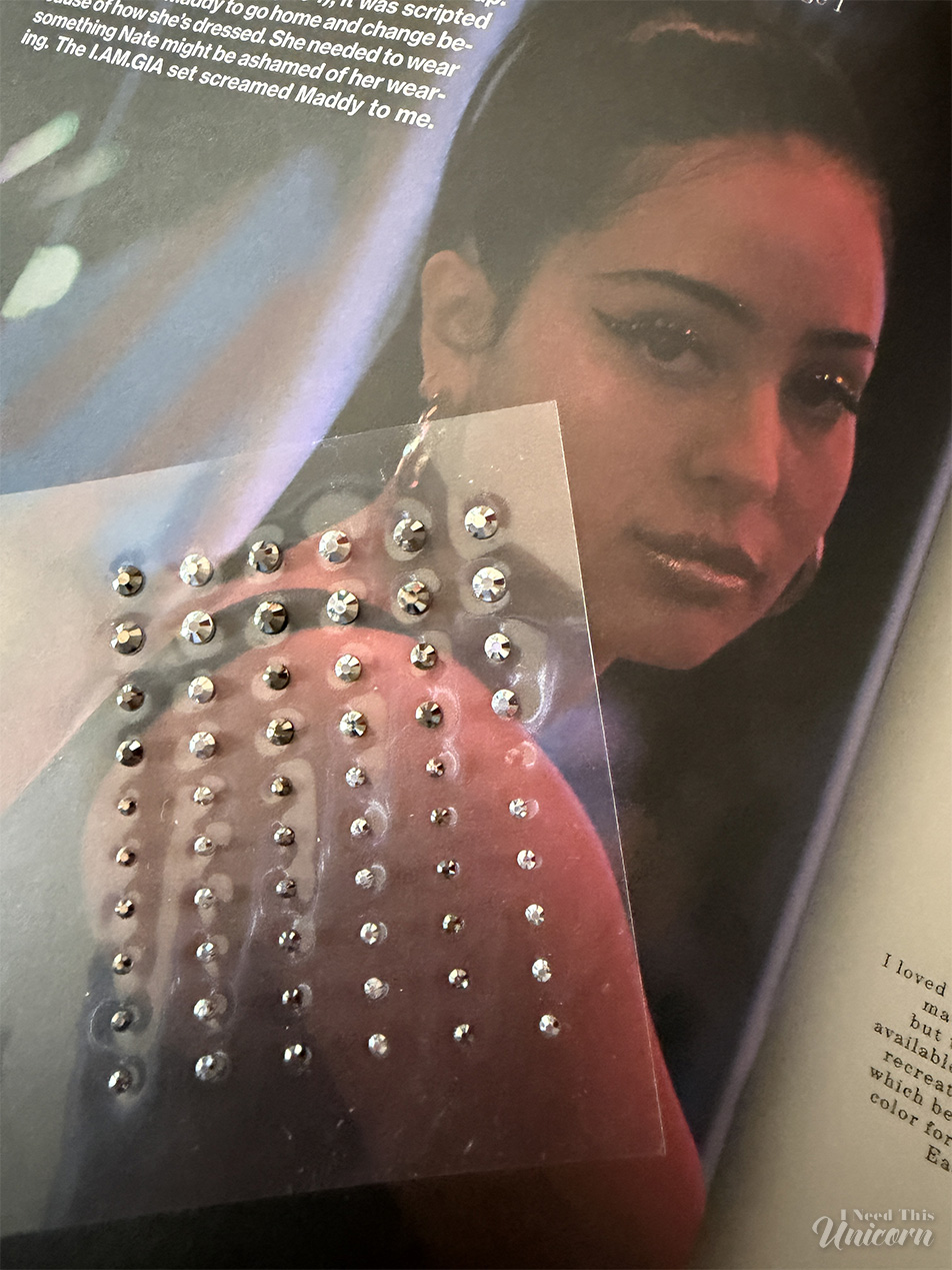 Half Magic Euphoria Face Gems pictured with still of Maddy Perez at the carnival wearing face gems on her eyeliner