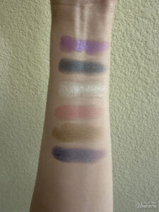 Half Magic Euphoria Eyeshadow Palette swatched on arm