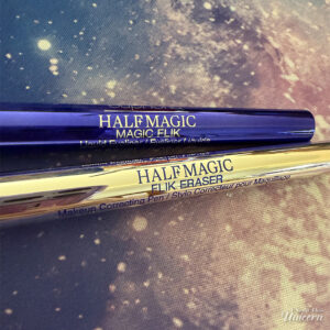 Half Magic Euphoria Magic Filk Eyeliner and Magic Flik Eraser pictured on a galaxy background