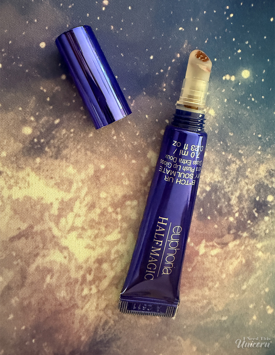 Half Magic Euphoria B*tch You’re My Soulmate Extra Plush Lip Gloss against a galaxy background. Opened to show color.