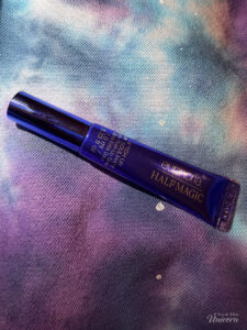 Half Magic Euphoria B*tch You’re My Soulmate Extra Plush Lip Gloss against a galaxy background.