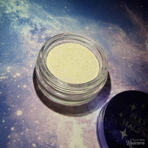 Half Magic Euphoria Glitter Puck in Feel Something pot on a galaxy background