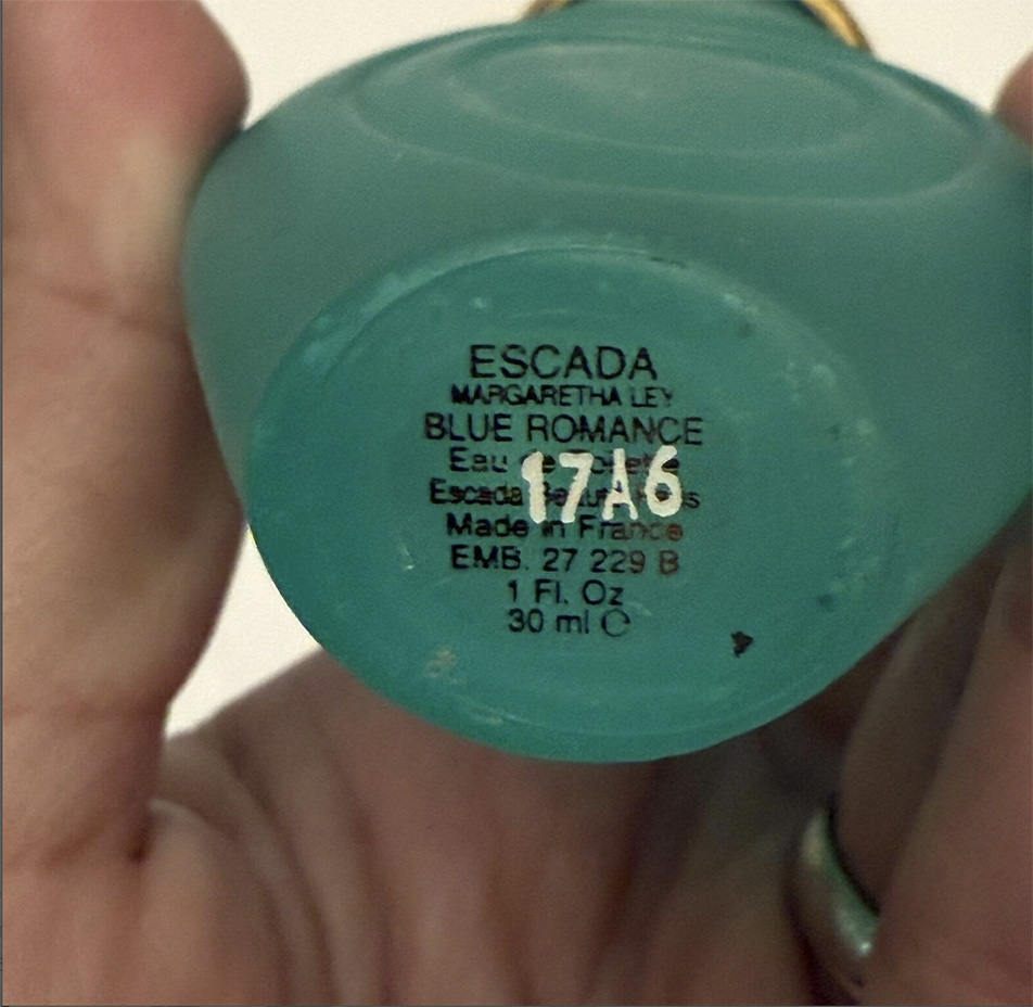 Screenshot of the Etsy seller showing the bottom label of the perfume bottle.