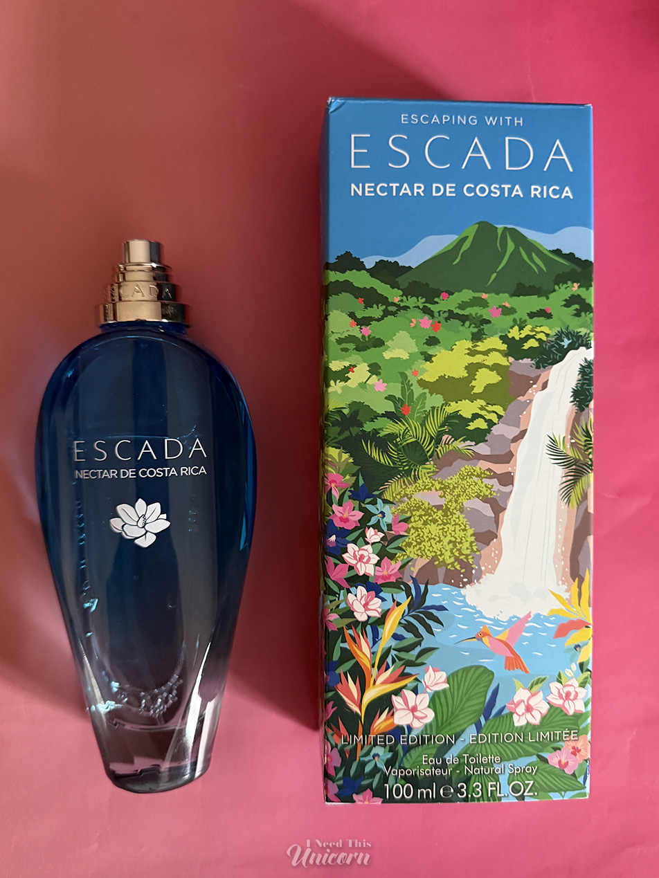 Bottle and illustrated box of Nectar de Costa Rica by Escada, on a pink background