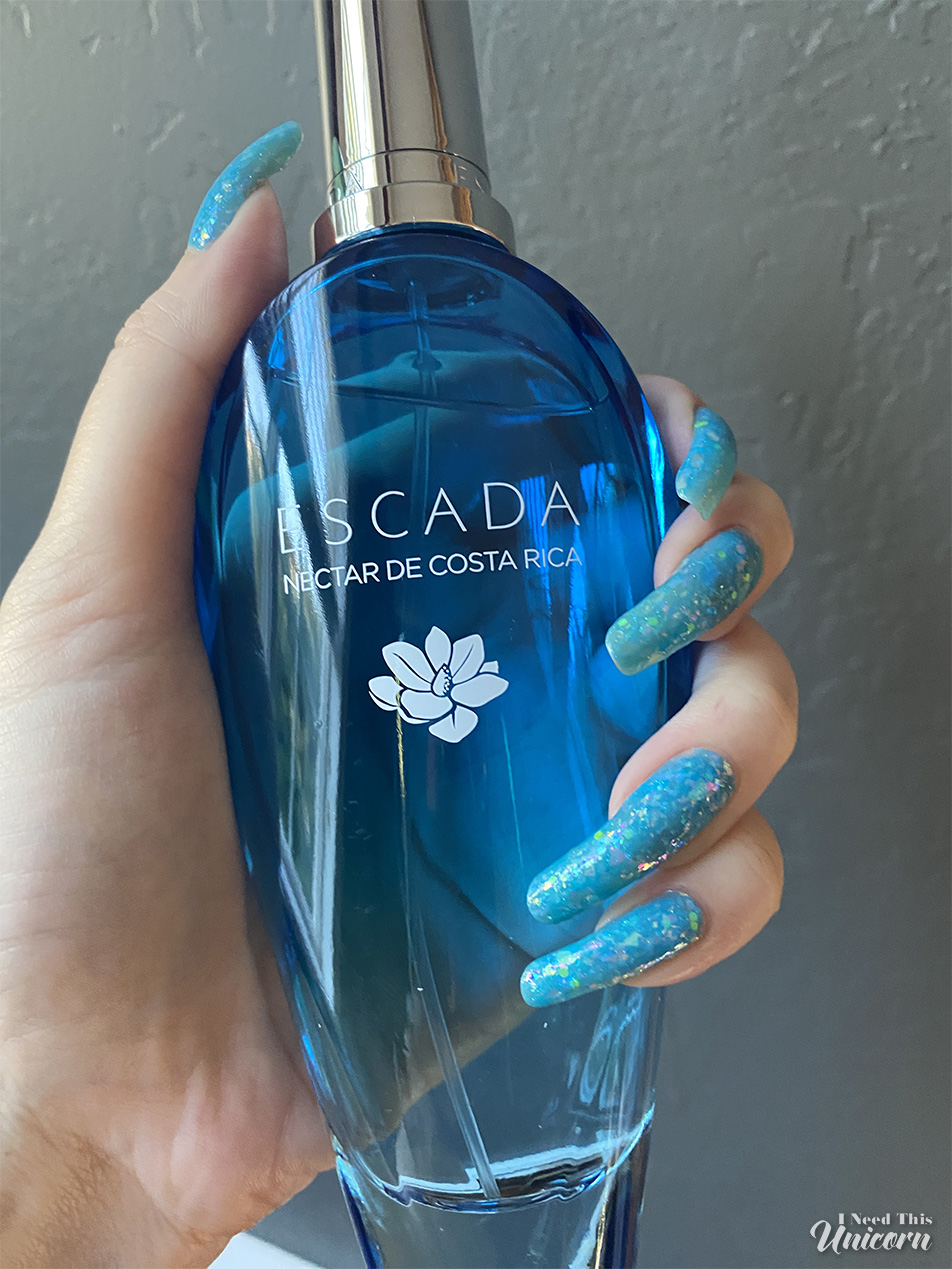 Holding a 3.3 oz bottle of Escada's Nectar de Costa Rica. Nail polish is: "Don't Cry, Bubbles" by Mooncat