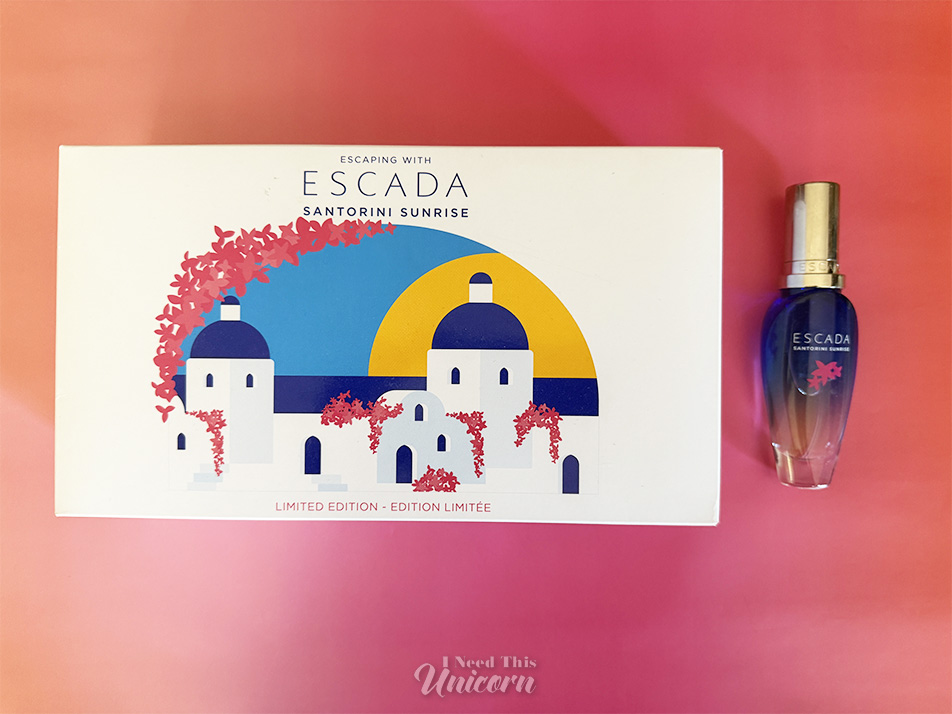 Box and bottle of Escada's Santorini Sunrise on an orange to pink background
