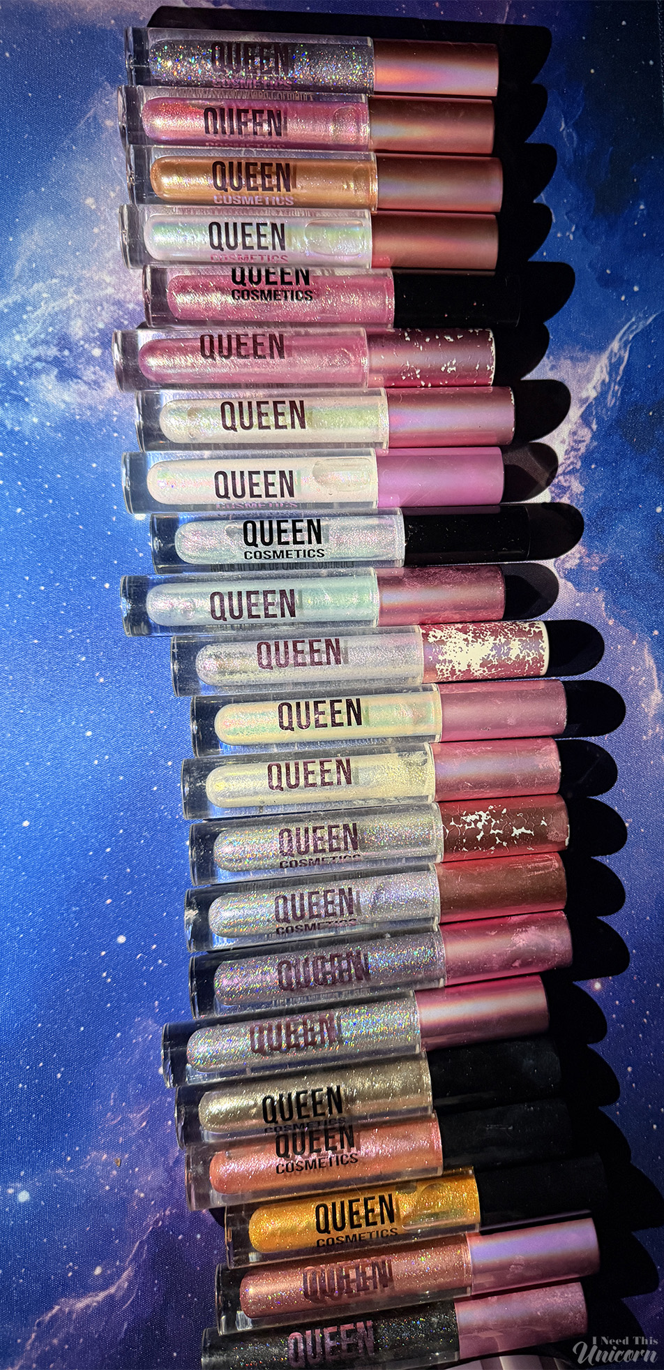 Queen Cosmetics Tester Diamond Shimmer Glosses | I Need This Unicorn Queen Cosmetics lip gloss collection featuring diamond shimmers, holographic, iridescent, and multichrome shades with rainbow sparkle and reflective shimmer.