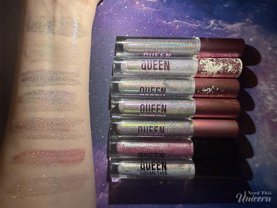 Queen Cosmetics Tester Diamond Shimmer Glosses | I Need This Unicorn Flash photograph of my personal favorite holographic and Diamond Shimmer lip glosses with the tubes next to the arm swatches.
