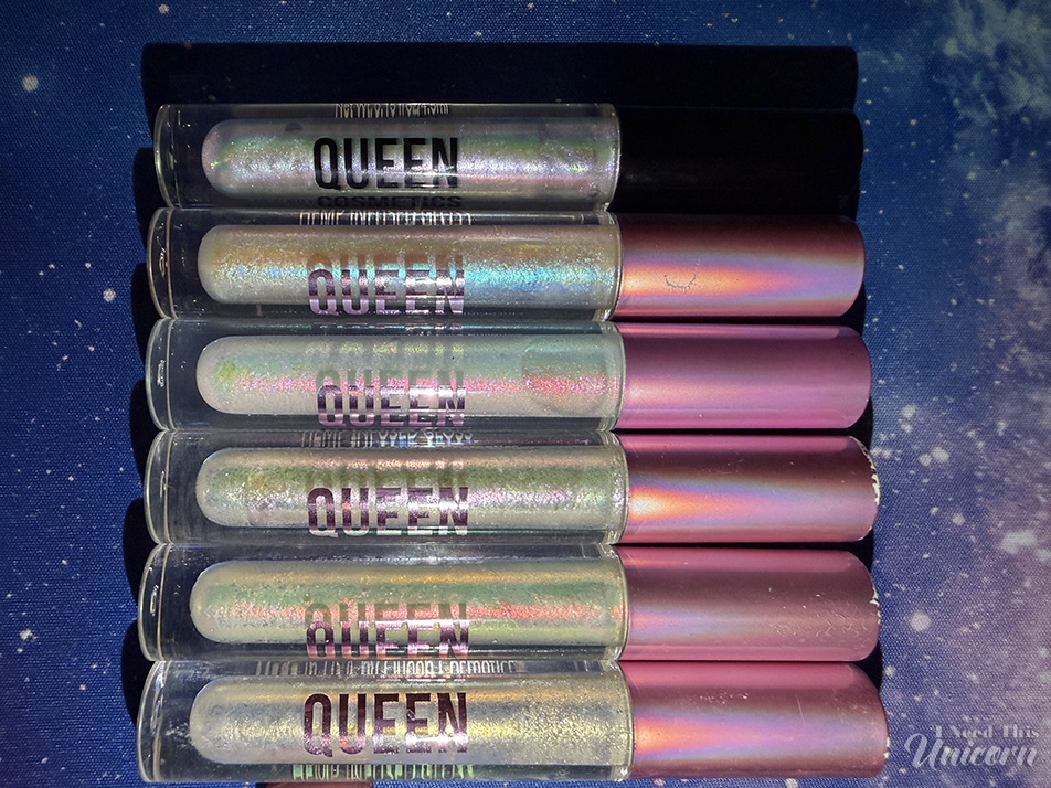 Queen Cosmetics Tester Diamond Shimmer Glosses | I Need This Unicorn Queen Cosmetics Tester #2 compared with the Stardom Collection and Aurora 2.0 lip glosses, showing similar opalescent white bases with pink, blue, green, and gold color-shifting shimmer.