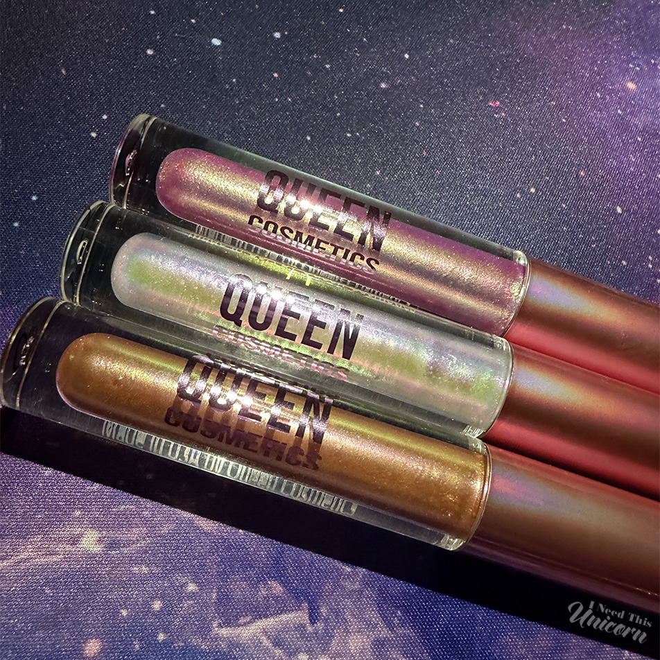 Queen Cosmetics Tester Diamond Shimmer Glosses | I Need This Unicorn Queen Cosmetics limited-edition Tester glosses displayed together, featuring three Diamond Shimmer shades with multi-dimensional sparkle and color-shifting finishes.