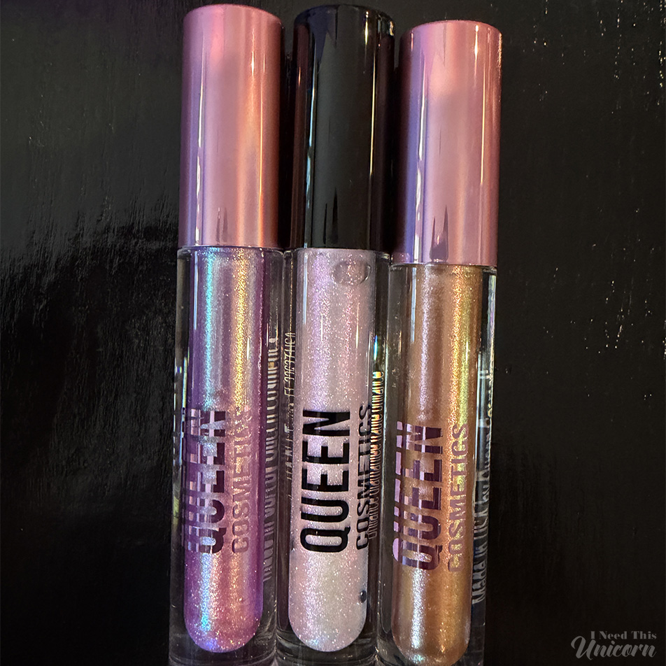 Queen Cosmetics Tester Diamond Shimmer Glosses | I Need This Unicorn Close-up of Queen Cosmetics Tester #1, Tester #2, and Tester #3 Diamond Shimmer lip glosses in the tubes, highlighting the pink-to-green, opalescent, and golden shimmer pigments.